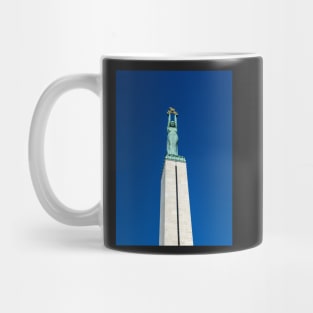 Figure of Liberty at the top of the Freedom Monument in Riga, Latvia Mug